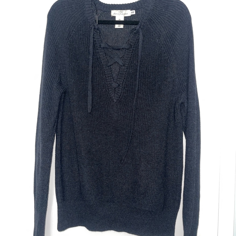 Black H&M sweater with tie up front. Size Large